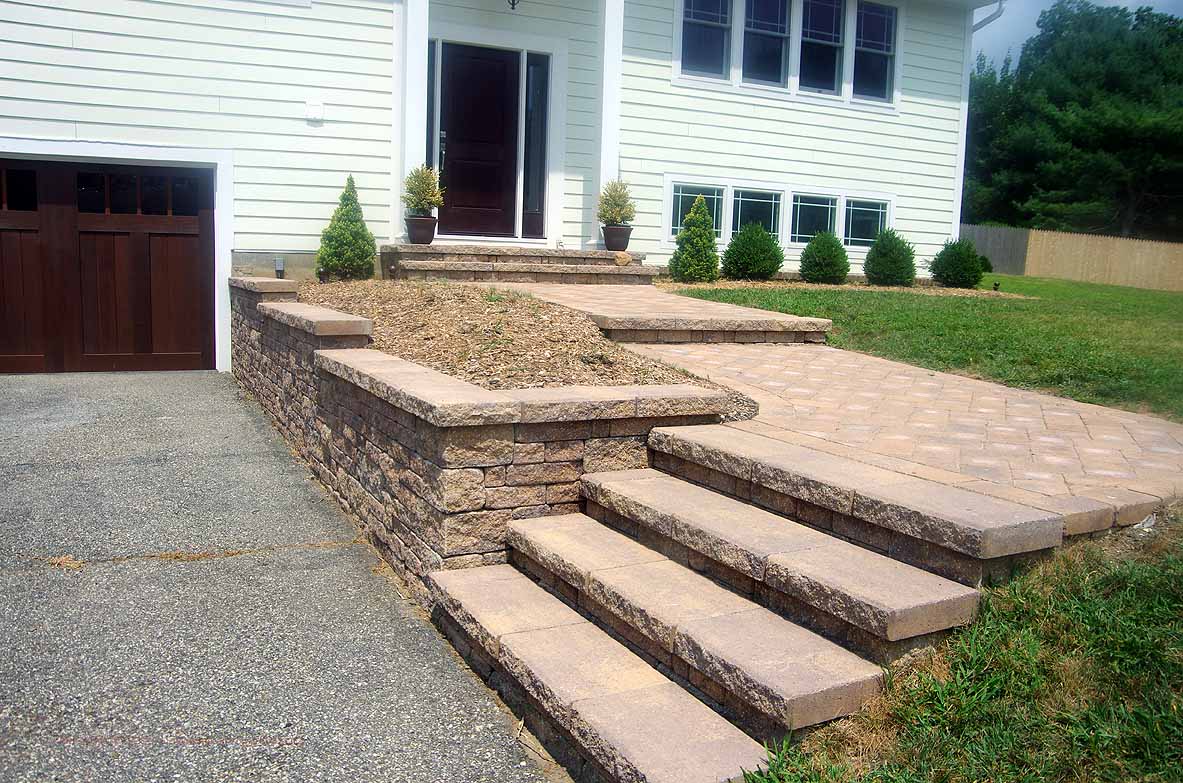 Retaining wall for driveway with stairs | CornerStone Wall Solutions