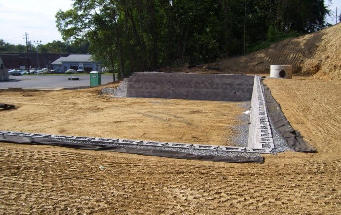 Commercial CornerStone retaining wall with gravel backfill and filter fabric.