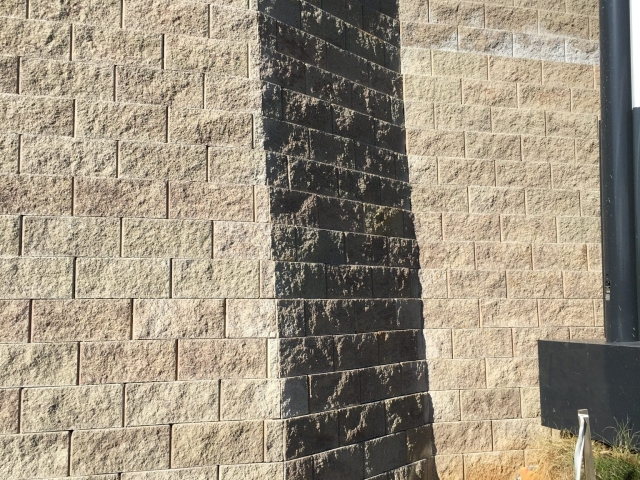 CornerStone 100 batter provides engineered strength for retaining wall.