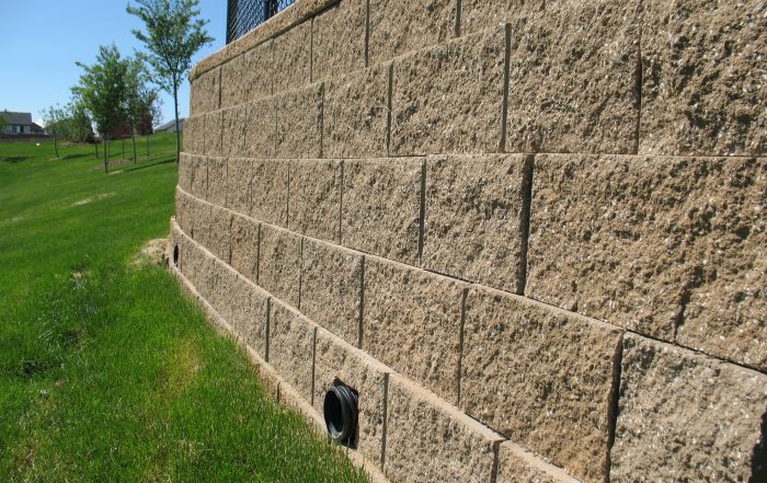 Engineered retaining walls have setbacks to enhance performance.