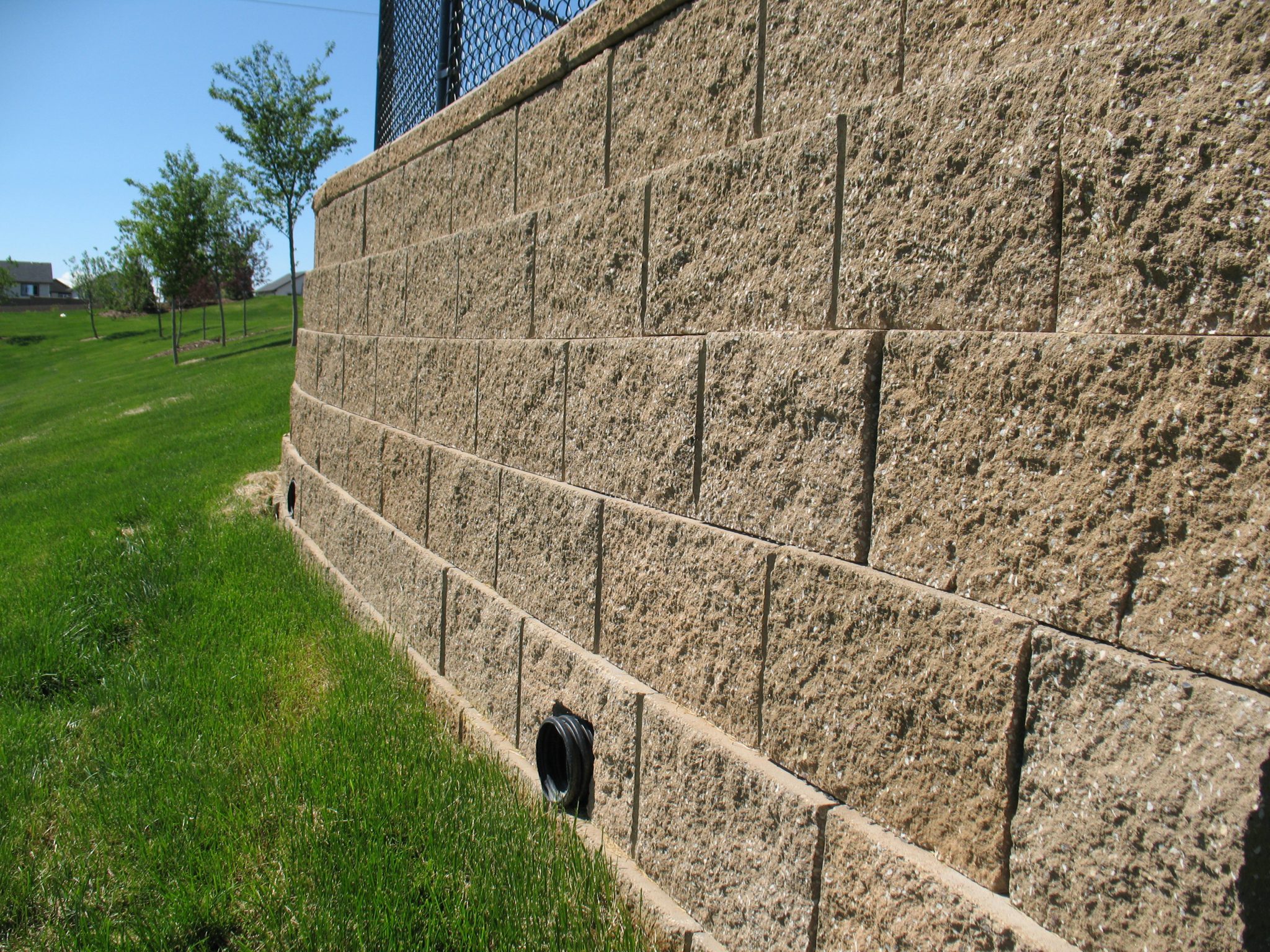 Engineered retaining walls have setbacks to enhance performance.