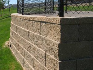 CornerStone retaining wall corner with fence hollow core.